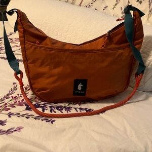 cotopaxi Orange Sling Shoulder Bag with Teal Strap